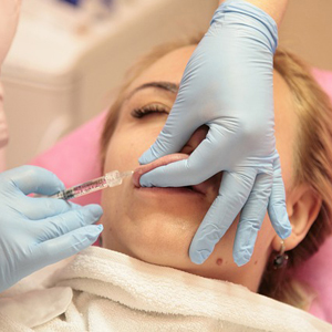 Lip filler injections are a popular cosmetic treatment to plump lips