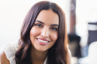 Girl Happy after applying facial filler to look good