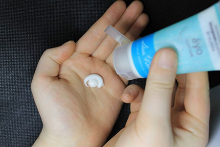 Moisturizer lotion in palm of hand