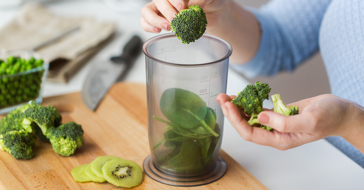 Lady making smoothie to reduce Eczema