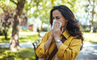 Woman outdoors having allergy