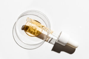 a dropper of serum, representing the question "when should i start using retinol?"