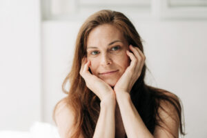 portrait of a pretty redhead woman with dry dull skin